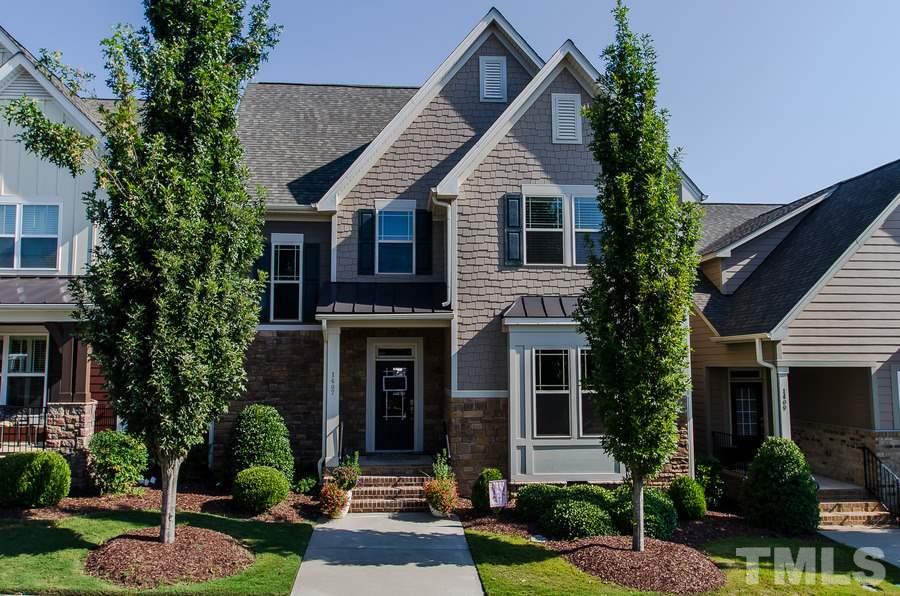 1407 Van Page Boulevard Raleigh, NC 27607 - Photo 1 of 25 a front view of a house with garden