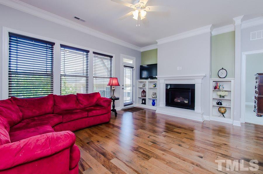 1407 Van Page Boulevard Raleigh, NC 27607 - Photo 12 of 25 a living room with furniture and a fireplace