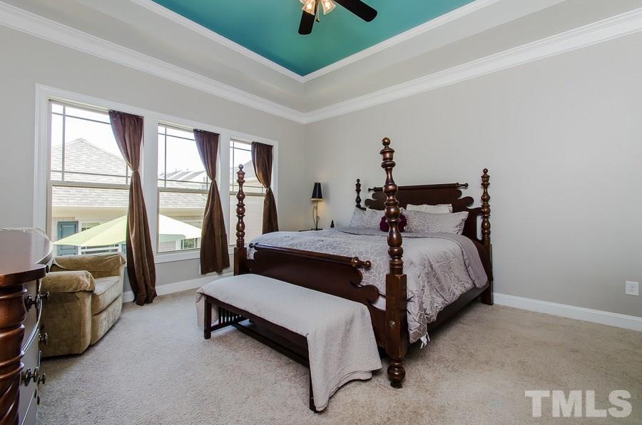 1407 Van Page Boulevard Raleigh, NC 27607 - Photo 13 of 25 a bedroom with a bed and a couch