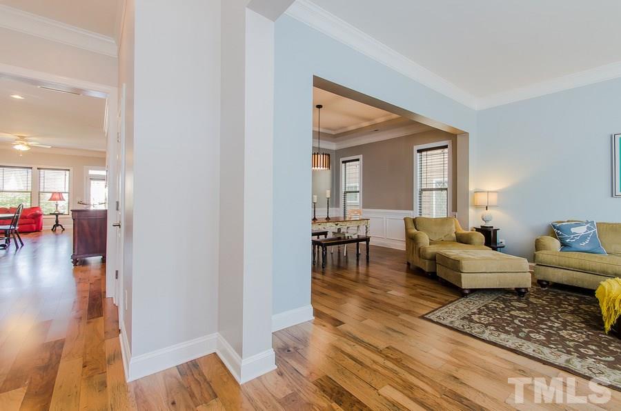 1407 Van Page Boulevard Raleigh, NC 27607 - Photo 3 of 25 a living room with furniture and a wooden floor