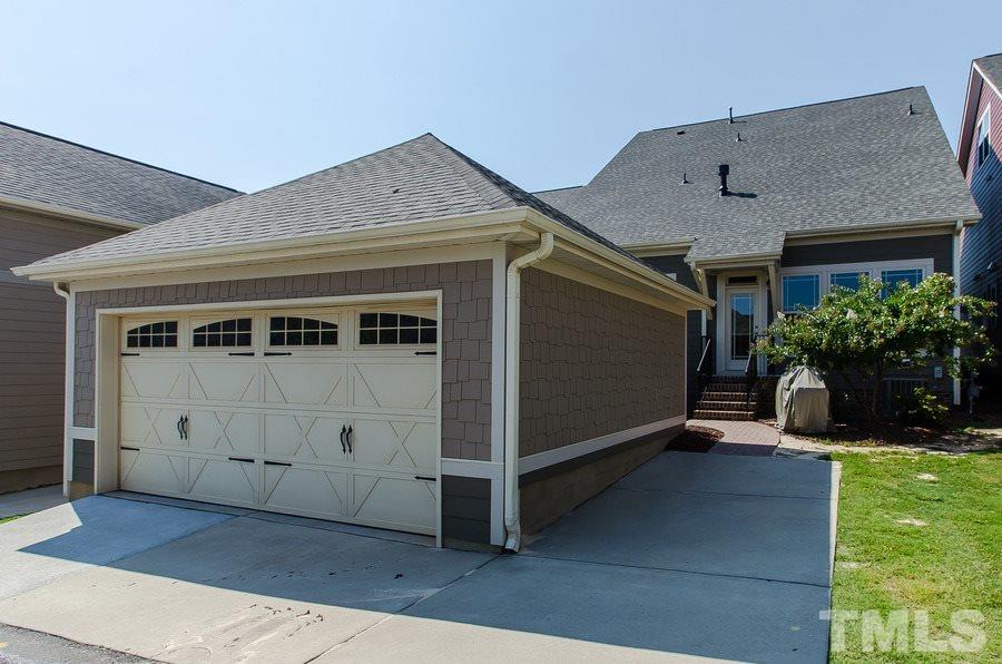1407 Van Page Boulevard Raleigh, NC 27607 - Photo 23 of 25 a view of a house with a yard