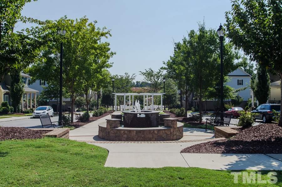 1407 Van Page Boulevard Raleigh, NC 27607 - Photo 25 of 25 a view of a house with patio and a garden