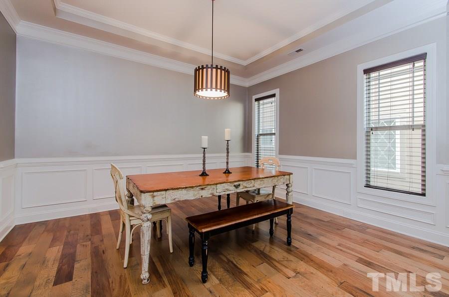 1407 Van Page Boulevard Raleigh, NC 27607 - Photo 6 of 25 a view of a room with furniture window and wooden floor