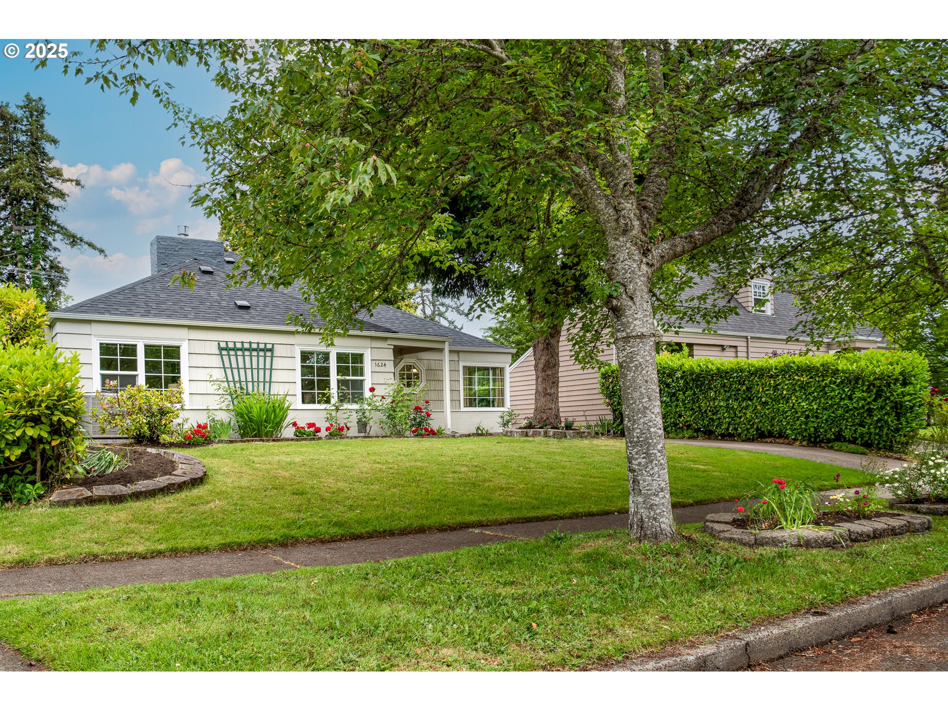 1624 Washington Street Eugene, OR 97401 - Photo 2 of 41 a front view of a house with a yard