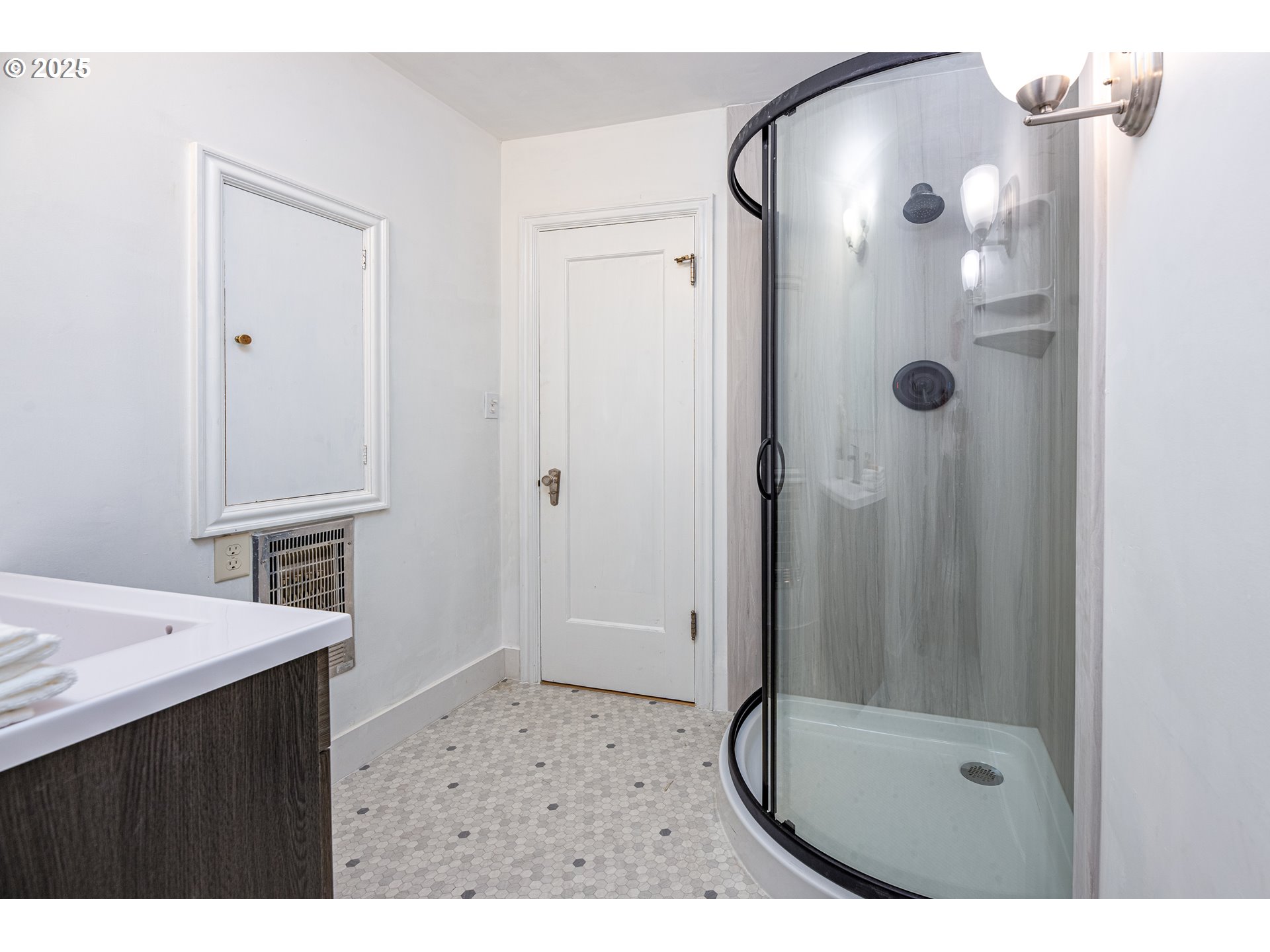 1624 Washington Street Eugene, OR 97401 - Photo 21 of 41 a bathroom with a granite countertop sink two mirror and shower