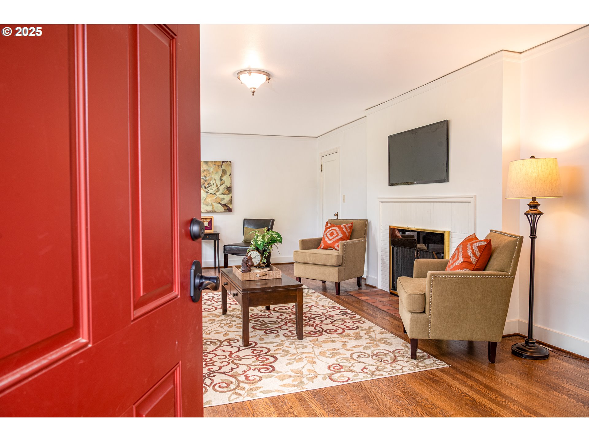 1624 Washington Street Eugene, OR 97401 - Photo 6 of 41 a living room with furniture a rug and a fireplace