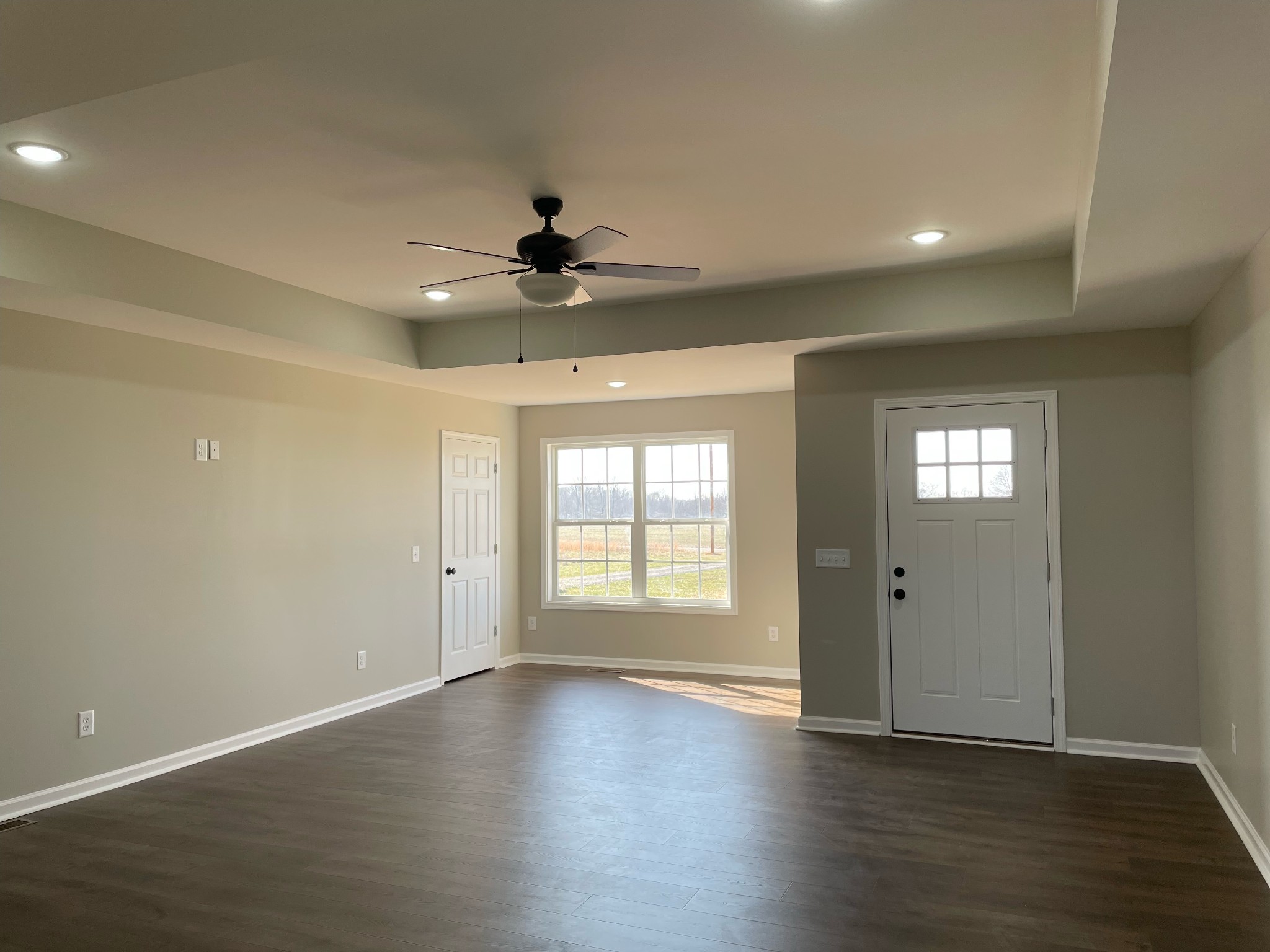 1185 Coleytown Road Lafayette, TN 37083 - Photo 9 of 20 a view of an empty room with window and wooden floor