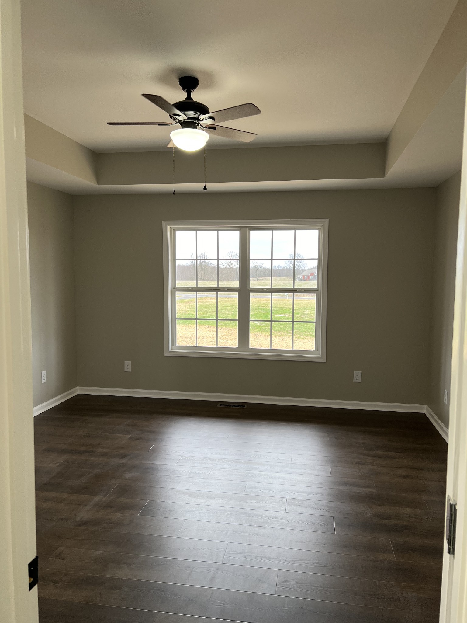 1185 Coleytown Road Lafayette, TN 37083 - Photo 10 of 20 a view of an empty room with wooden floor and a window
