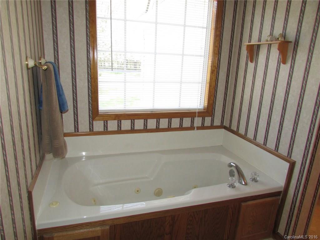 6274 Stokes Ferry Road Salisbury, NC 28146 - Photo 14 of 24 a bathroom with a bathtub
