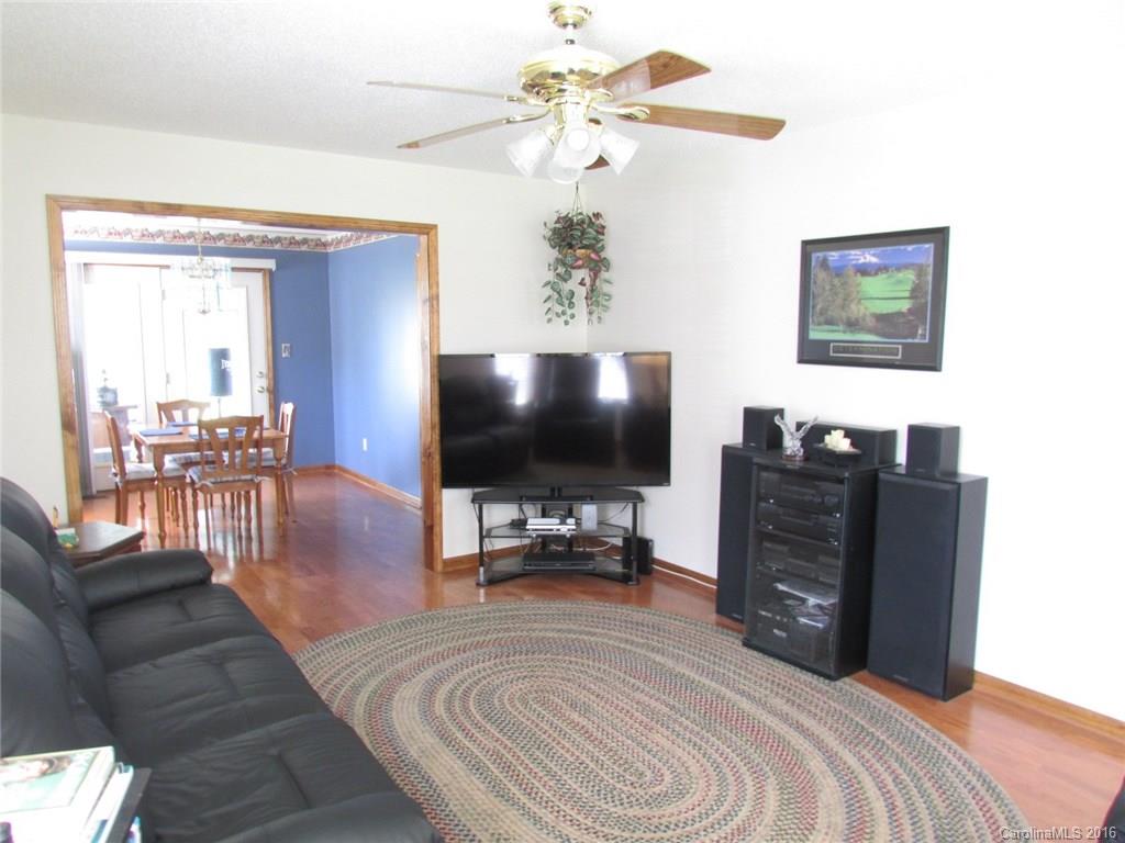 6274 Stokes Ferry Road Salisbury, NC 28146 - Photo 3 of 24 a bedroom with a bed and a flat screen tv