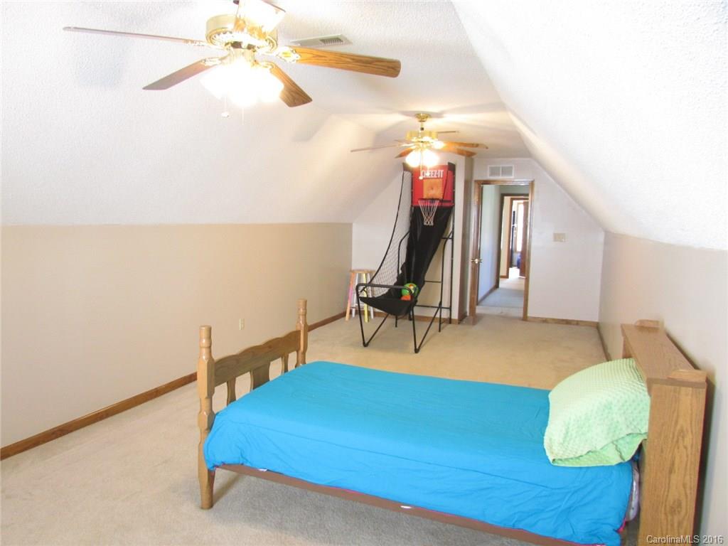 6274 Stokes Ferry Road Salisbury, NC 28146 - Photo 22 of 24 a view of a room with gym equipment