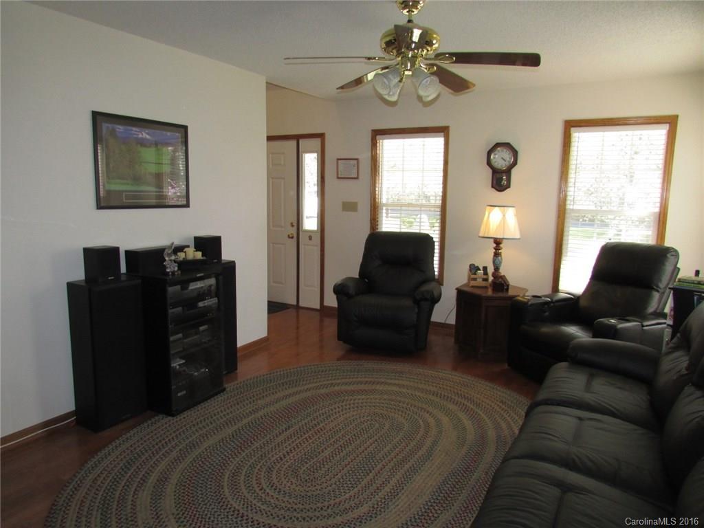 6274 Stokes Ferry Road Salisbury, NC 28146 - Photo 4 of 24 a bedroom with a bed and furniture