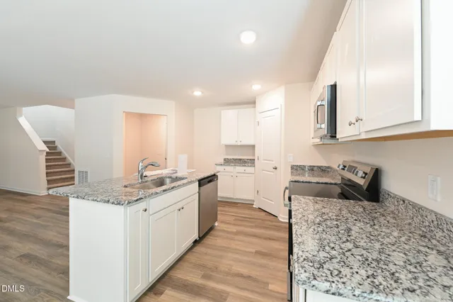 a view of cabinets and wooden floor