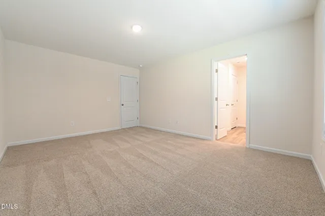 a bathroom with a double vanity sink and a toilet