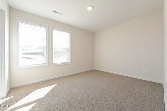 a bathroom with a granite countertop sink toilet a large mirror and shower