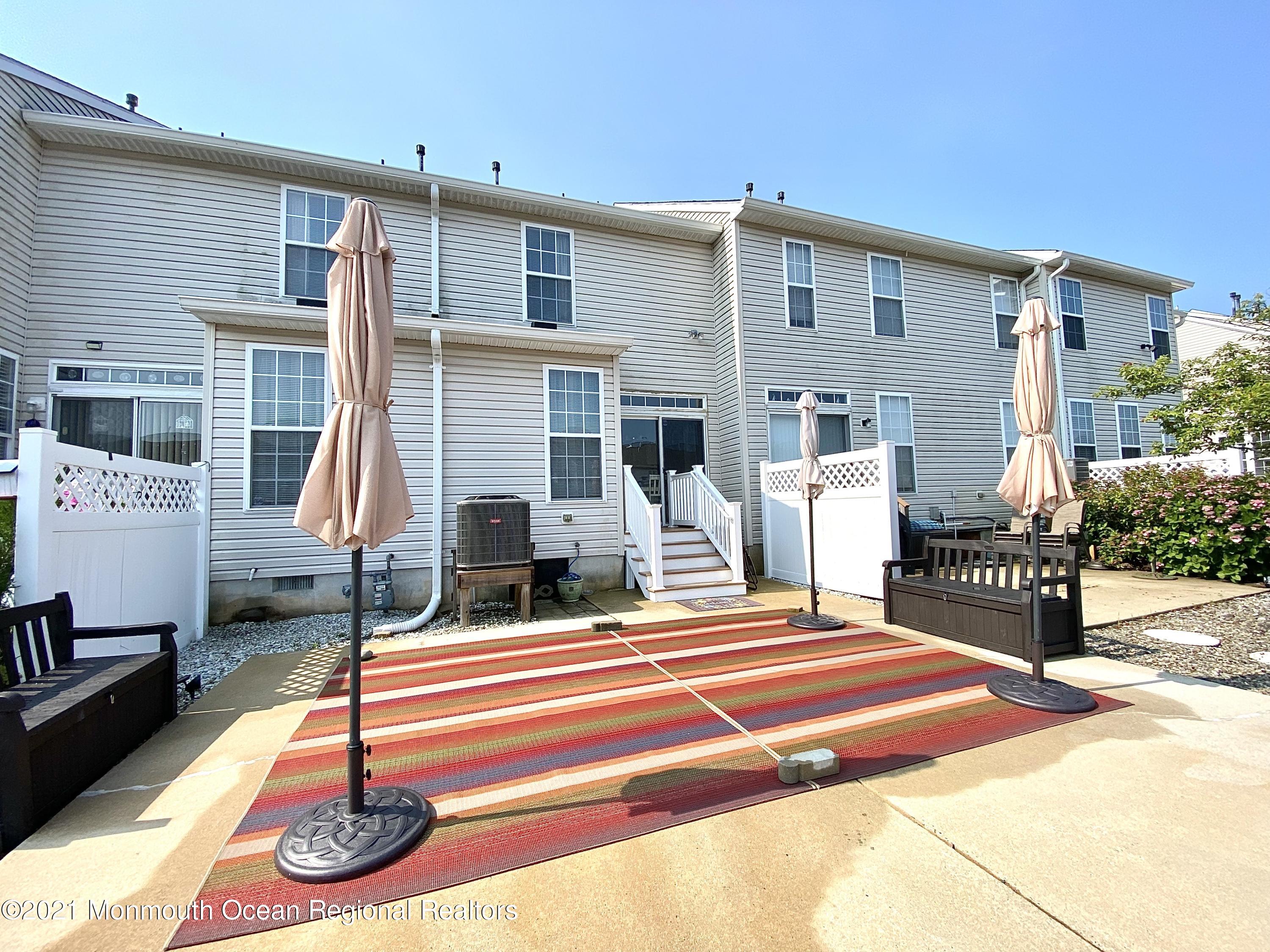 3 Skimmer Lane, Unit 38 Bayville, NJ 08721 - Photo 2 of 22 a house view with a outdoor space