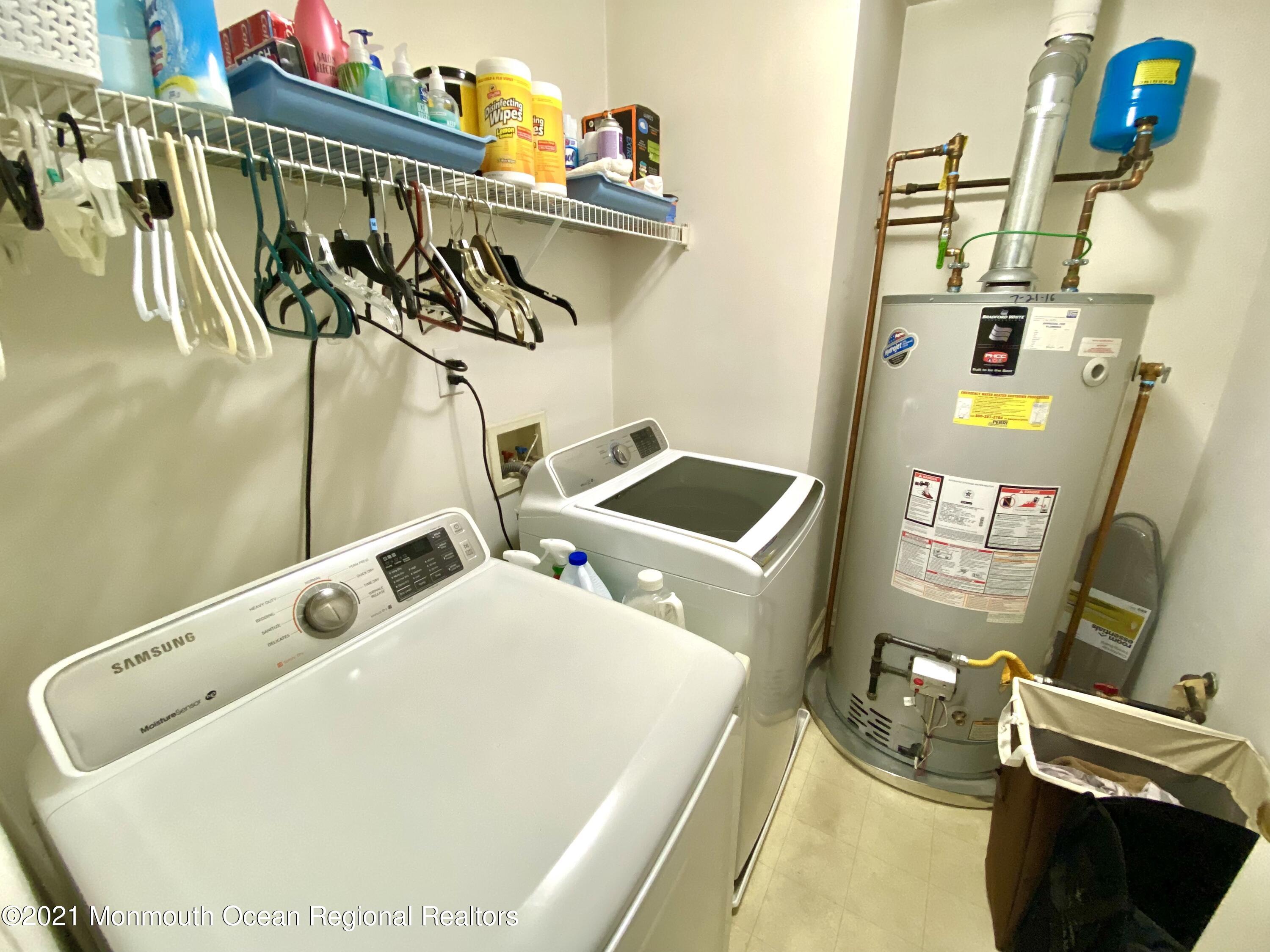3 Skimmer Lane, Unit 38 Bayville, NJ 08721 - Photo 13 of 22 a utility room with dryer and washer