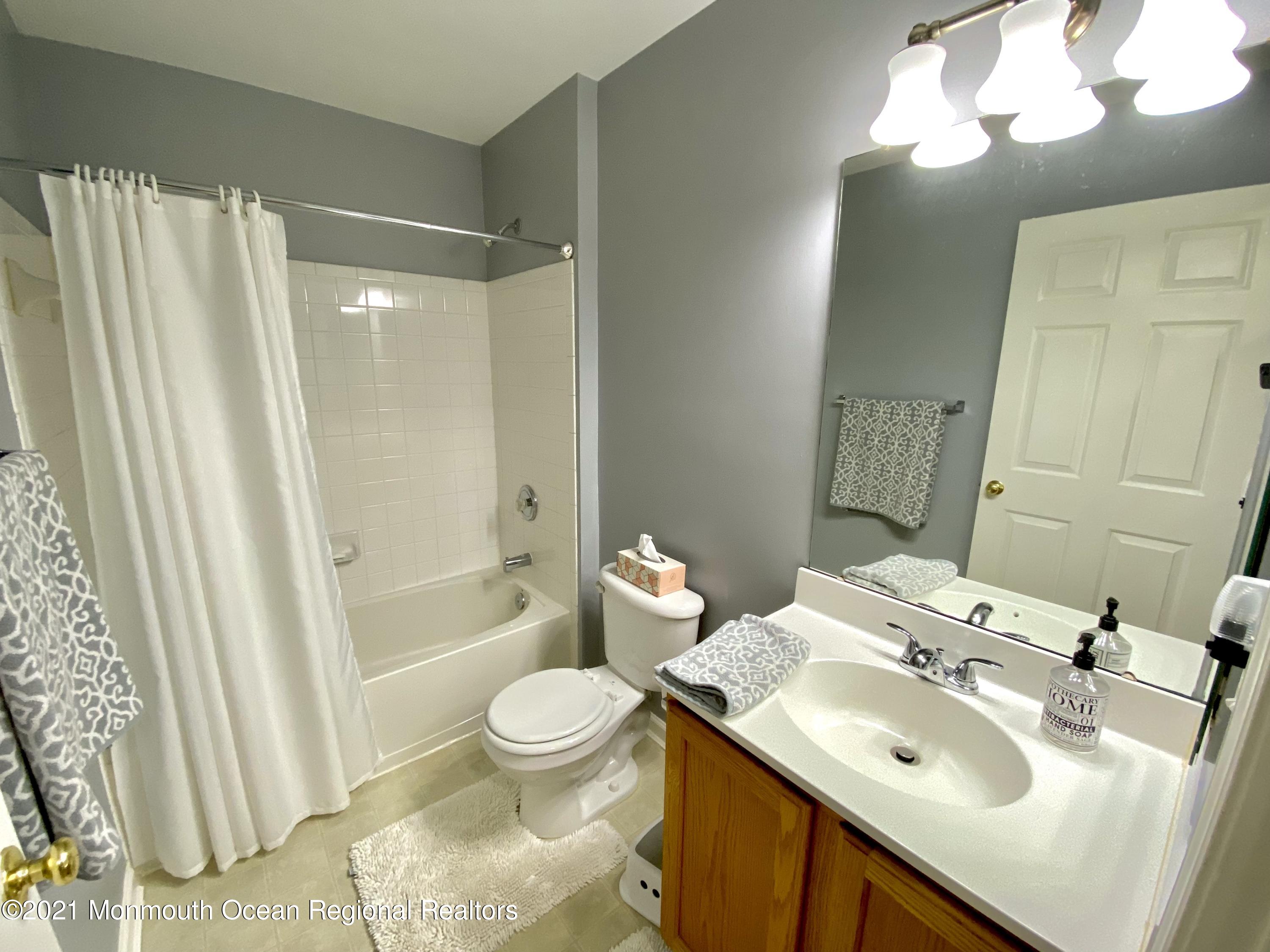 3 Skimmer Lane, Unit 38 Bayville, NJ 08721 - Photo 17 of 22 a bathroom with a sink toilet and shower