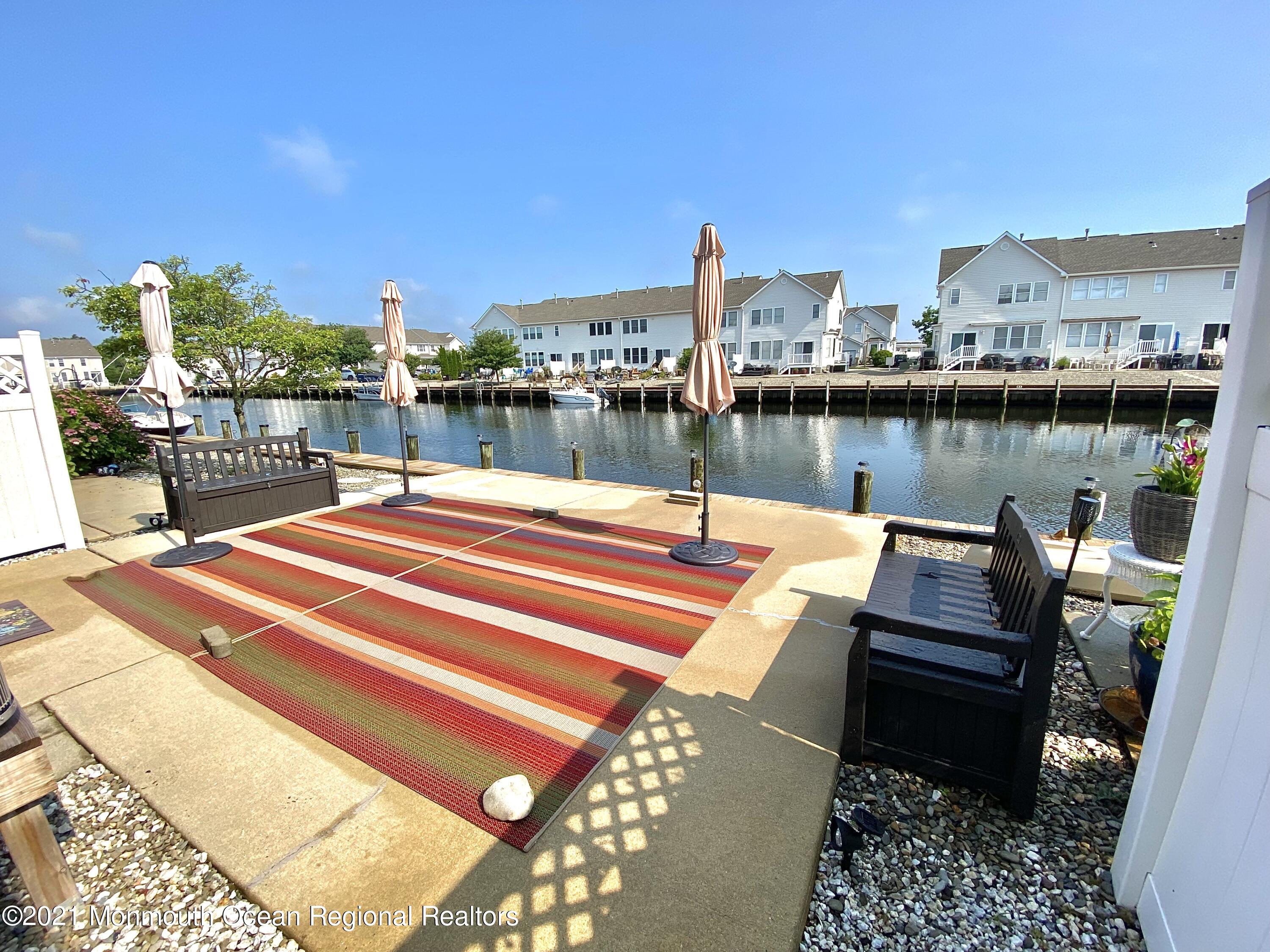 3 Skimmer Lane, Unit 38 Bayville, NJ 08721 - Photo 3 of 22 a view of a terrace with chairs