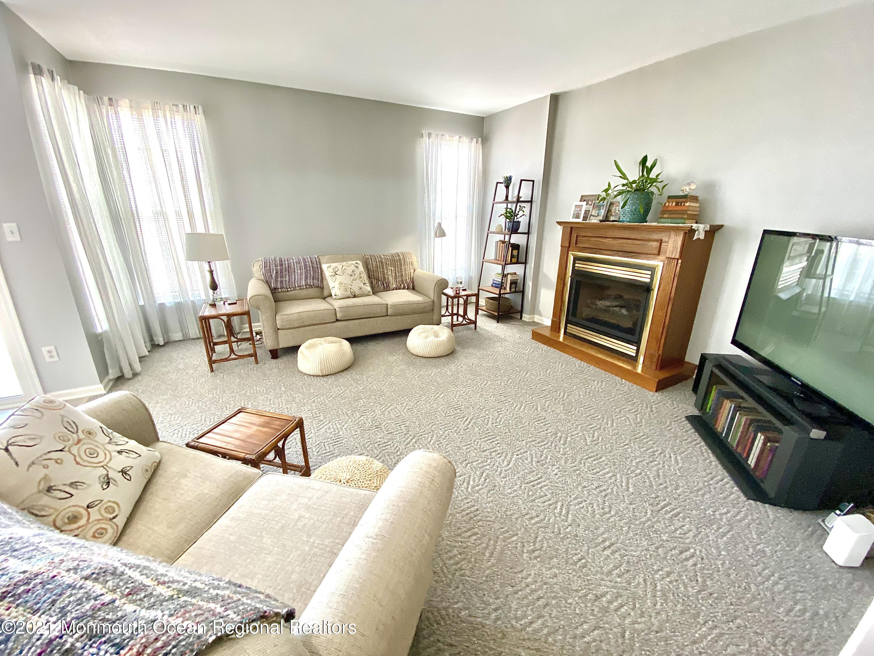 3 Skimmer Lane, Unit 38 Bayville, NJ 08721 - Photo 10 of 22 a living room with furniture and a fireplace