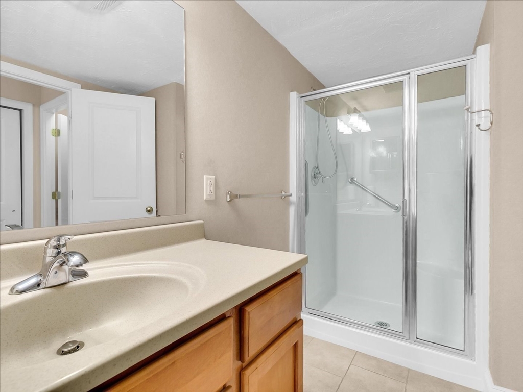 1500 Worcester Road, Unit 221 Framingham, MA 01702 - Photo 18 of 34 a bathroom with a sink and a mirror