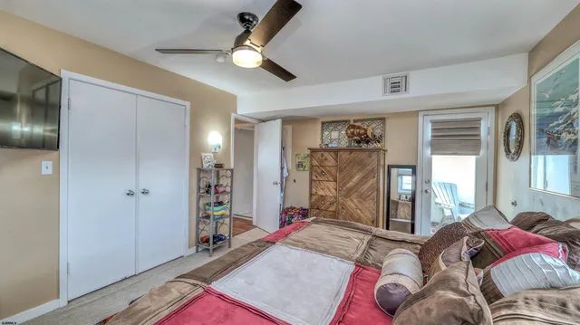 a bed room with a bed and a large window