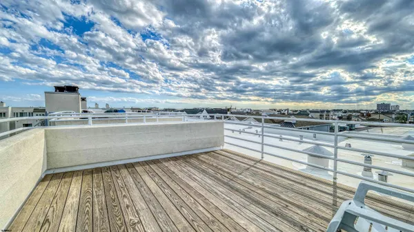 a view of kitchen with stove and sink