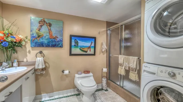 a bathroom with a sink a toilet and a shower