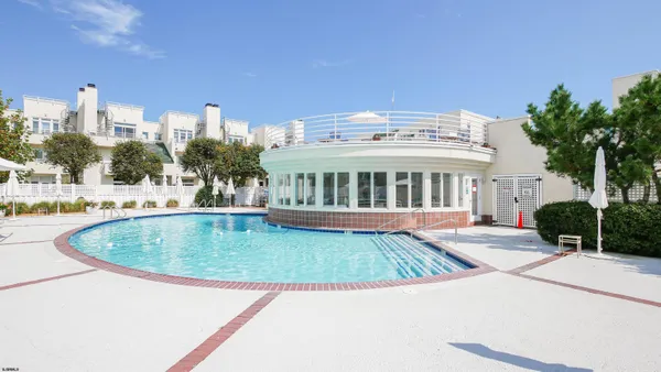 a view of a swimming pool with a patio