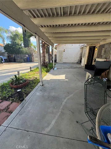 a view of swimming pool with outdoor seating and plants