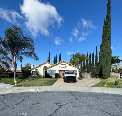 a car parked in front of a house