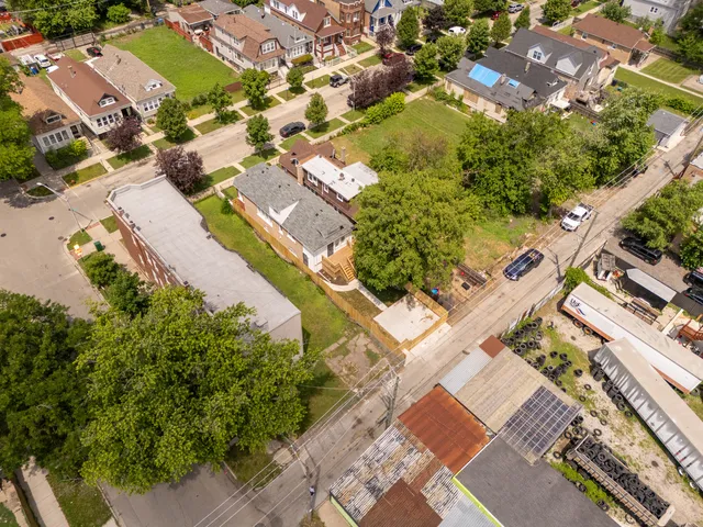 an aerial view of residential houses with outdoor space
