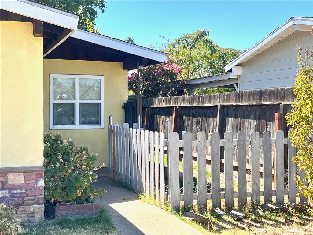 1550 Primrose Avenue Merced, CA 95340 - Photo 4 of 46 a front view of a house with a yard