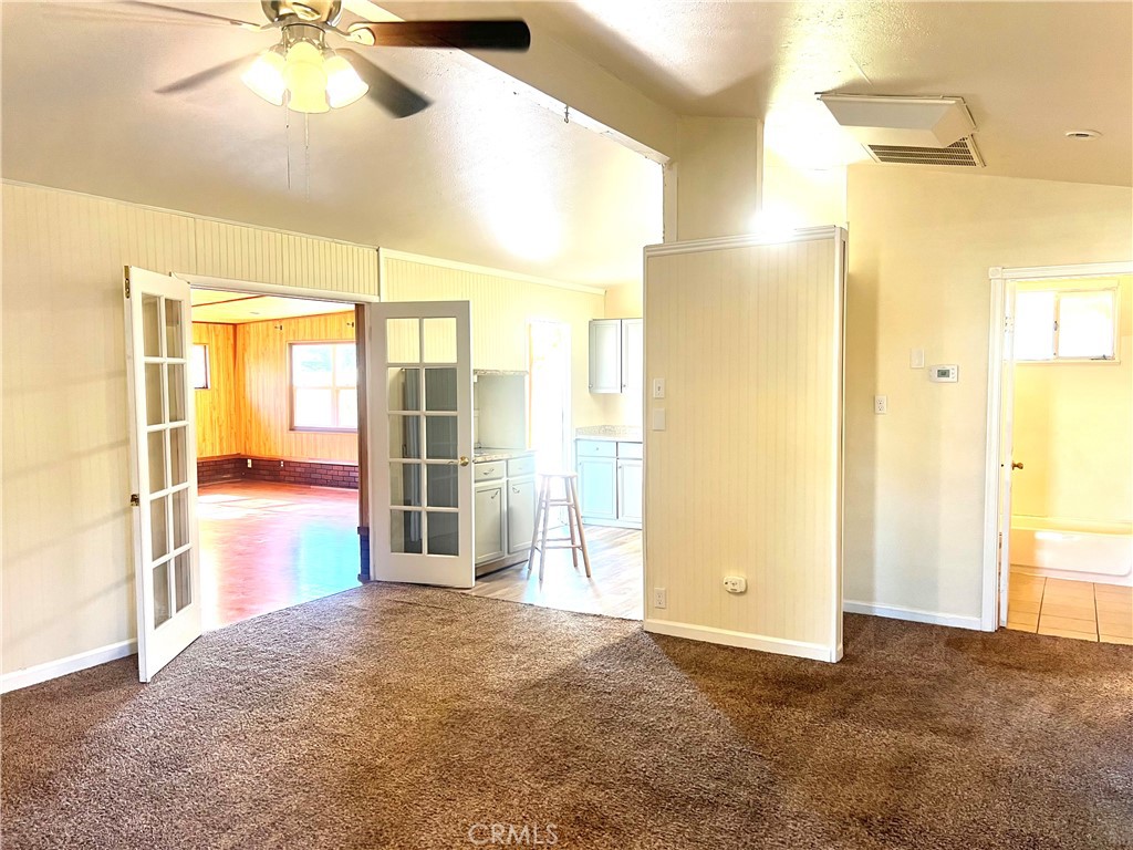 1550 Primrose Avenue Merced, CA 95340 - Photo 7 of 46 a view of a room with a ceiling fan and bathroom