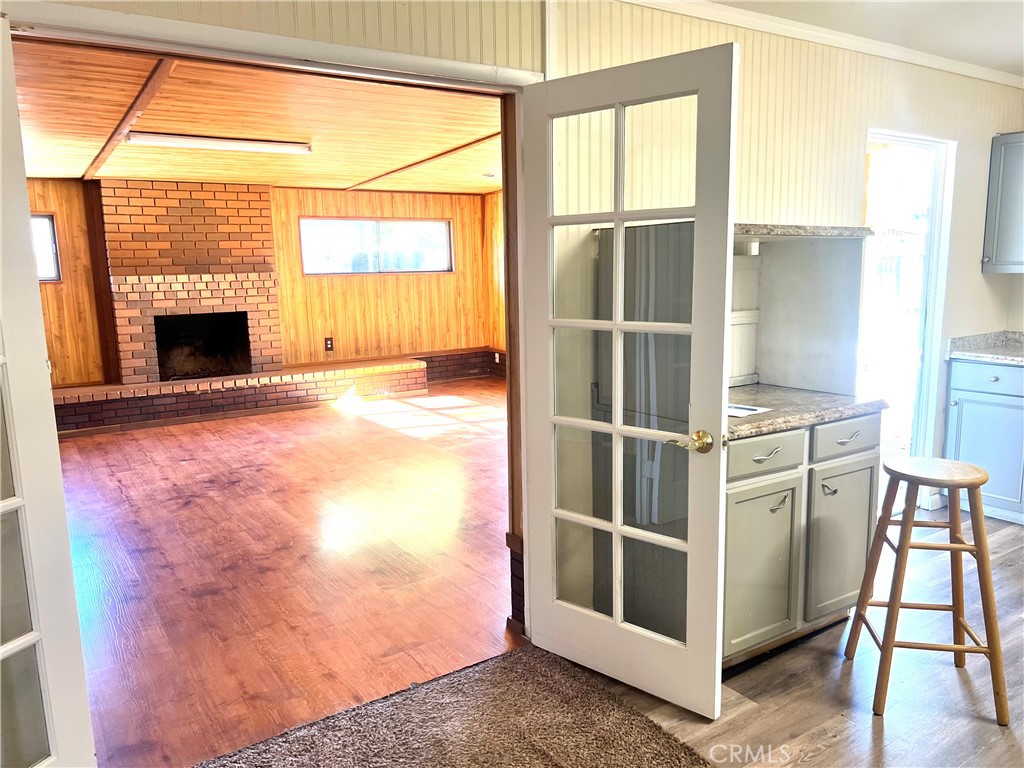 1550 Primrose Avenue Merced, CA 95340 - Photo 10 of 46 a view of a kitchen with furniture and a fireplace
