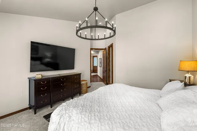 a bathroom with a double vanity sink mirror and shower