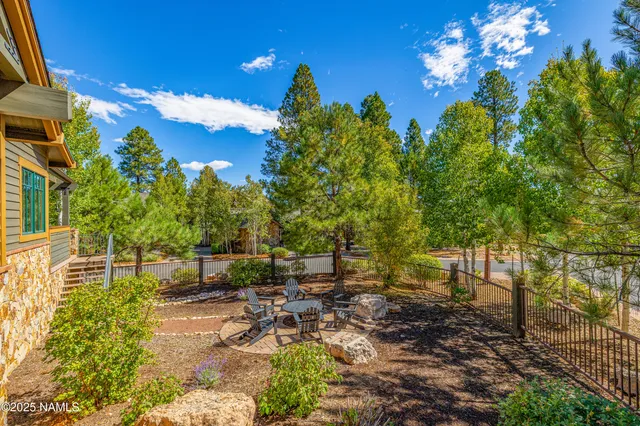 a view of a patio with table and chairs and wooden floor