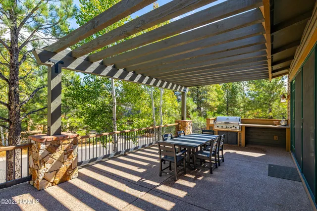 a view of a patio with wooden floor