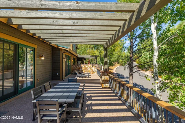 a view of a chairs and table in a backyard