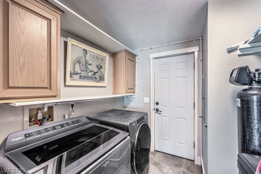 4375 Pinwheel Street Logandale, NV 89021 - Photo 30 of 52 Functional laundry space featuring modern appliances and practical storage solutions.