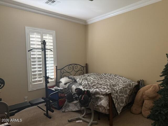 16121 West Berkeley Road Goodyear, AZ 85395 - Photo 11 of 20 a bedroom with a bed and a window