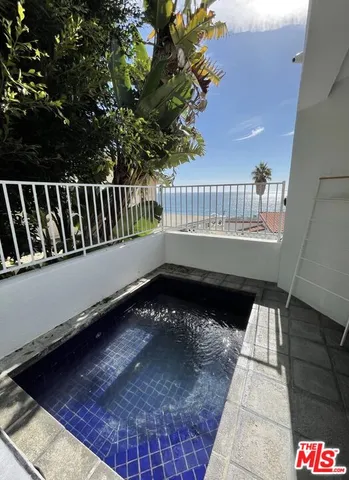 a view of a balcony with a chair
