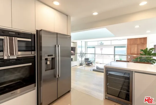 a kitchen with a refrigerator and a counter top