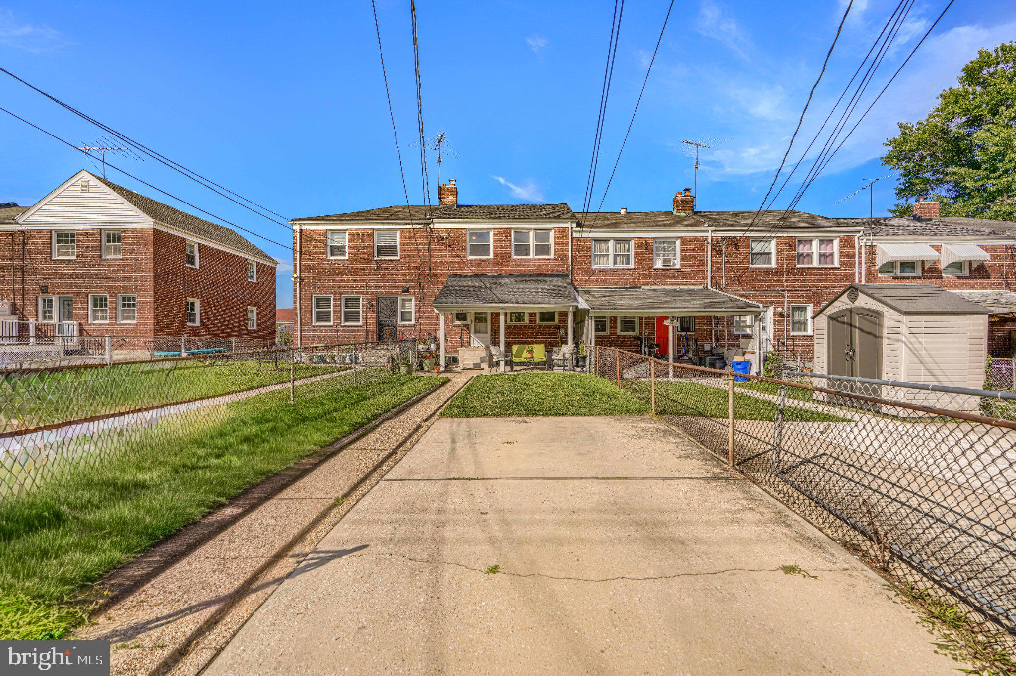 1639 Walterswood Road Baltimore, MD 21239 - Photo 49 of 49 Charming brick homes with green lawns.