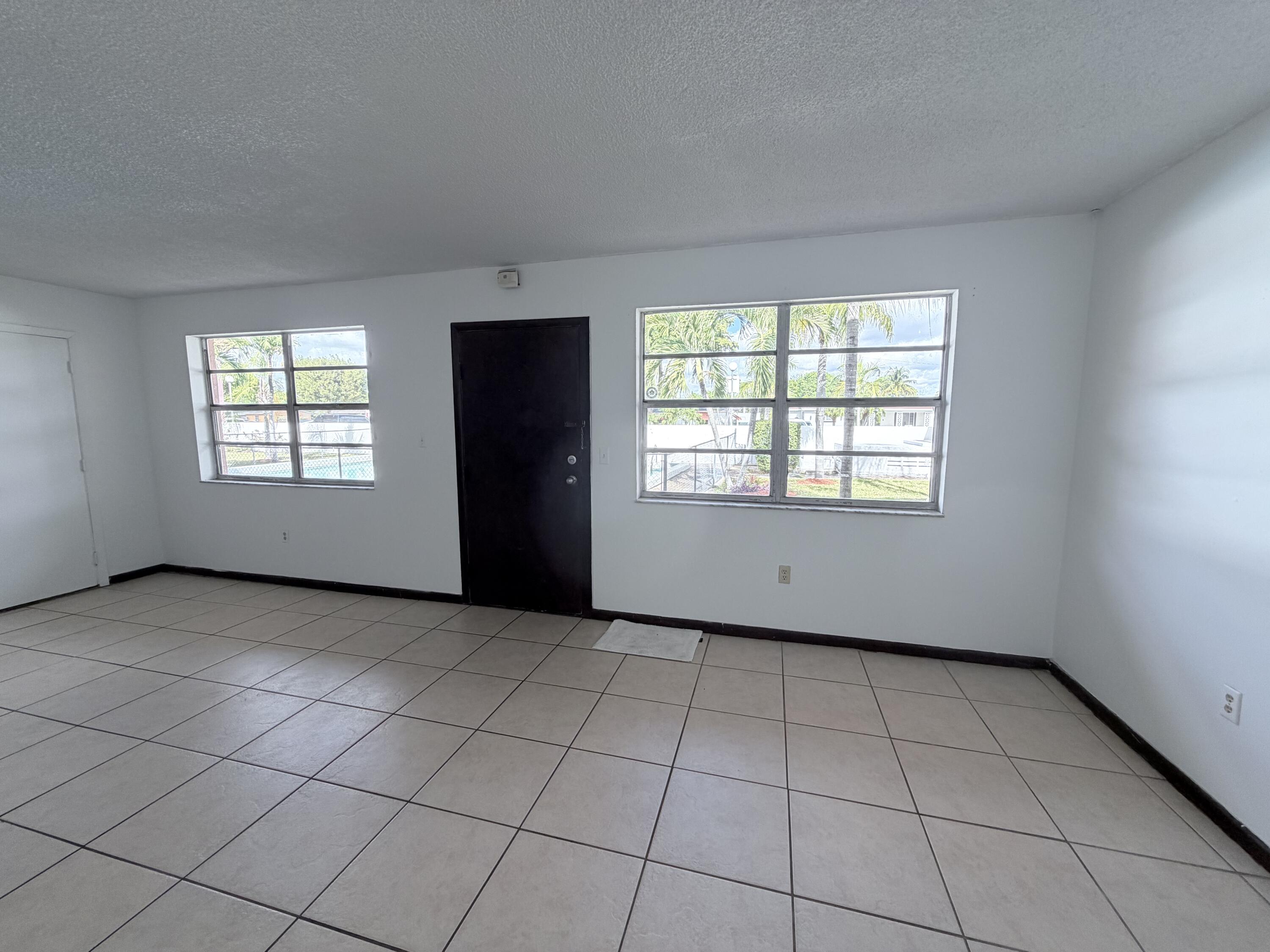 6050 Southwest 27th Street Miramar, FL 33023 - Photo 11 of 40 an empty room with windows