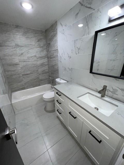 6050 Southwest 27th Street Miramar, FL 33023 - Photo 12 of 40 a bathroom with a granite countertop sink a toilet and a mirror