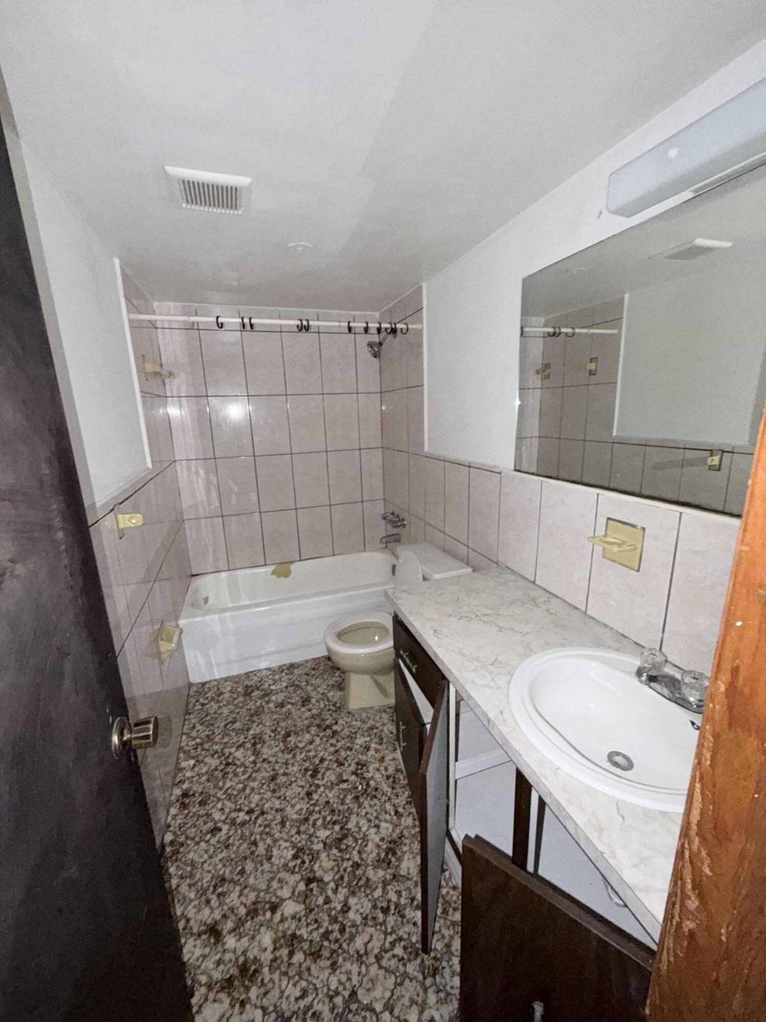 6050 Southwest 27th Street Miramar, FL 33023 - Photo 13 of 40 a bathroom with a sink toilet and shower