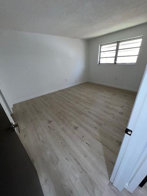 6050 Southwest 27th Street Miramar, FL 33023 - Photo 14 of 40 wooden floor in an empty room with a window