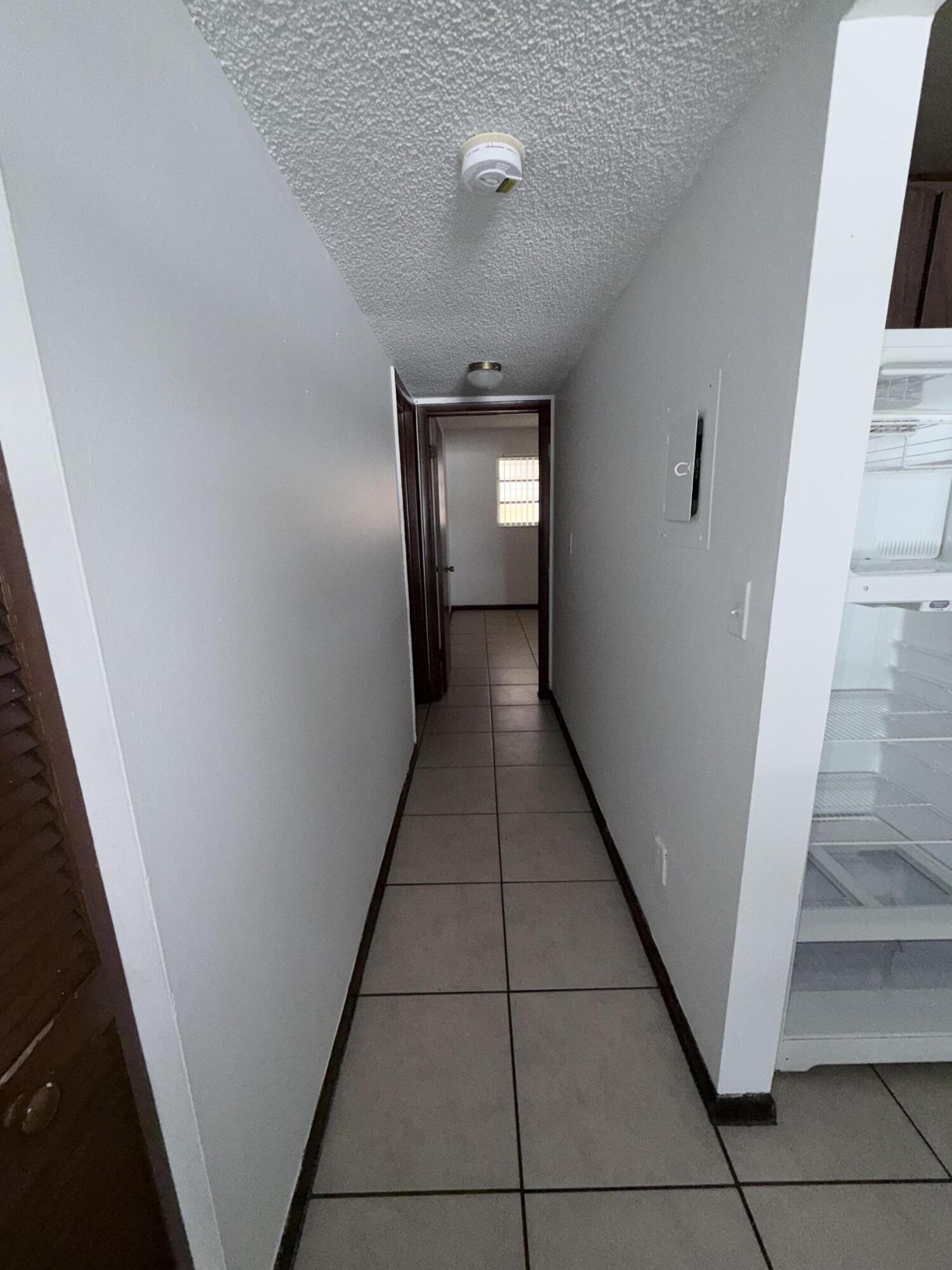6050 Southwest 27th Street Miramar, FL 33023 - Photo 20 of 40 a hallway view with staircase