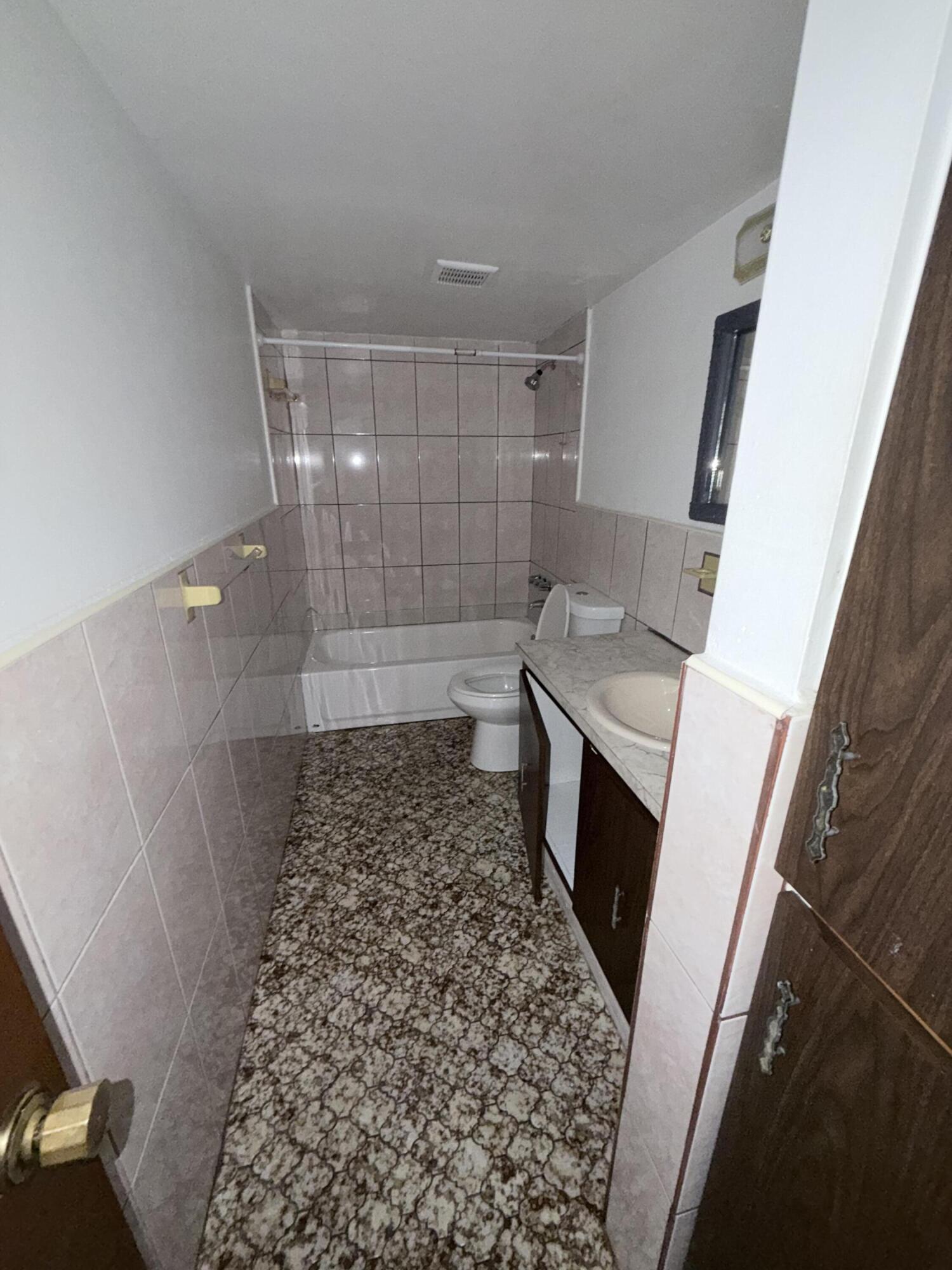 6050 Southwest 27th Street Miramar, FL 33023 - Photo 25 of 40 a bathroom with a sink a toilet and shower